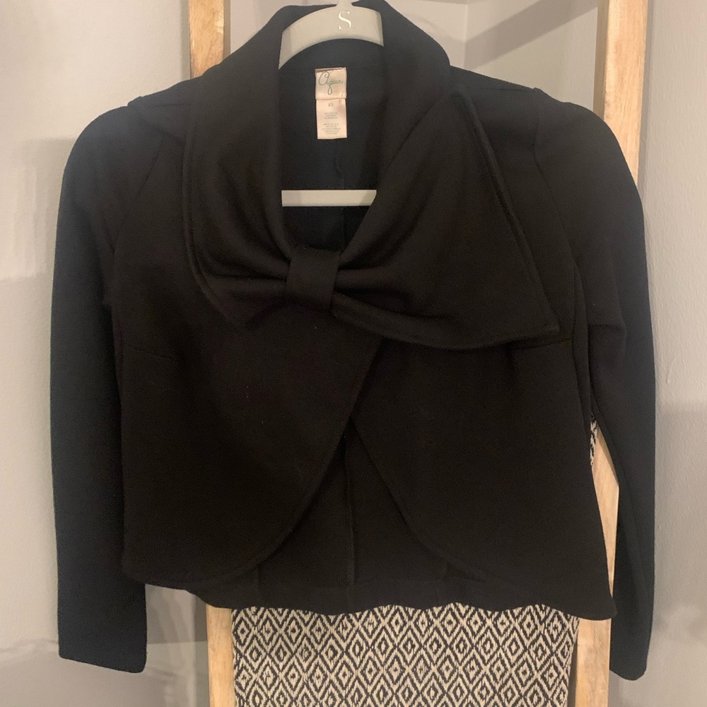 Black blazer- size xs. Cute bow on front with a button for a stylish look.